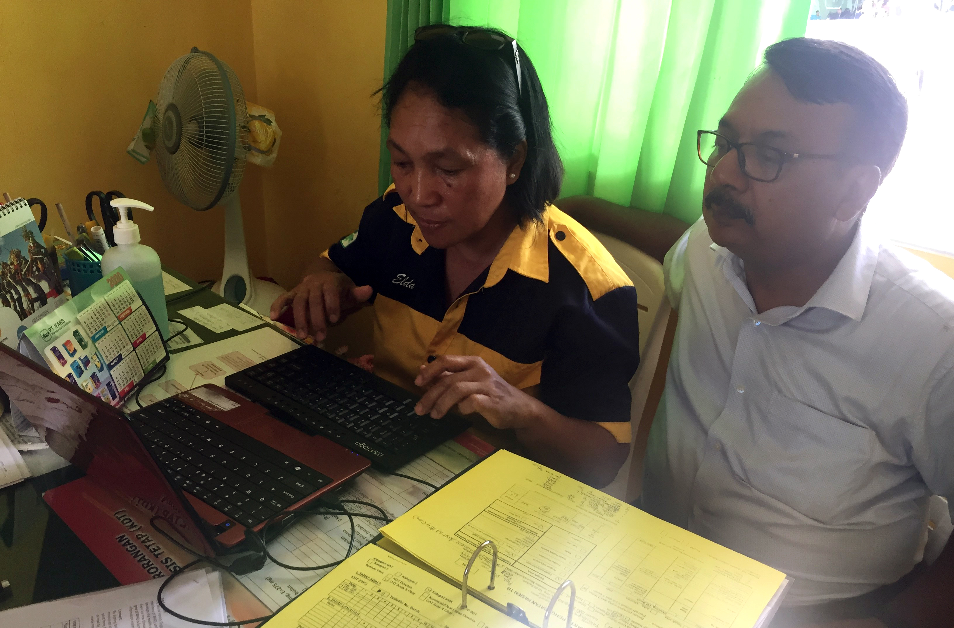 Experts reviewing the process of data entry